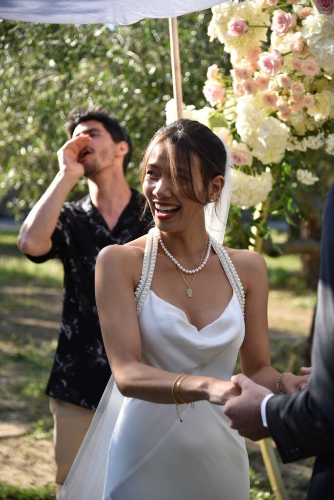 Bride Lili holding hands with Gabriel | Esthesis Events