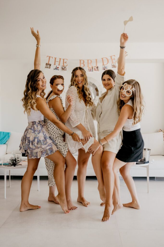 Marie and her friends posing as they prepare for the wedding | Esthesis Events