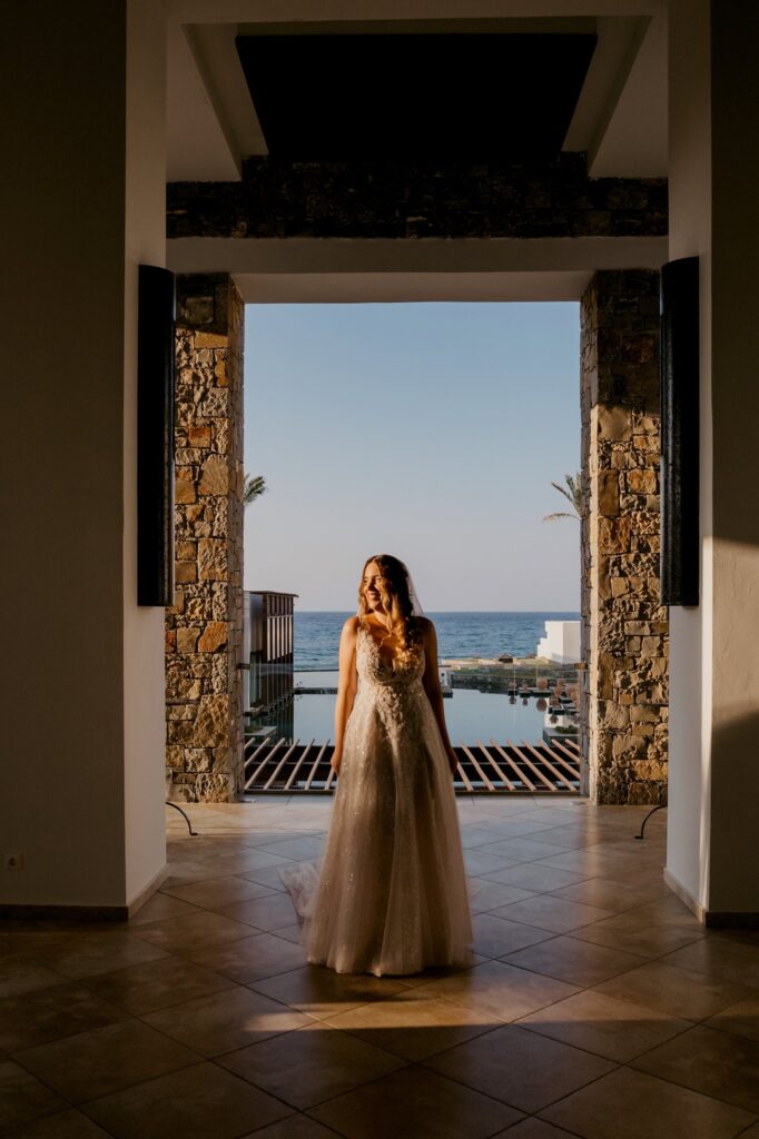 Marie posing with the pool and the sea in the backround | Esthesis Events