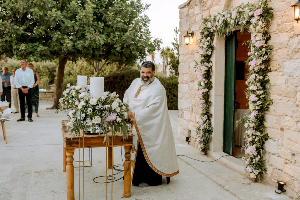 The orthodox priest at the end of the wedding ceremony | Esthesis Events