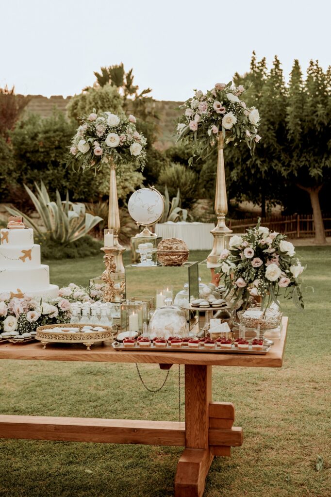 The welcome sign and the dessert station before the wedding feast | Esthesis Events