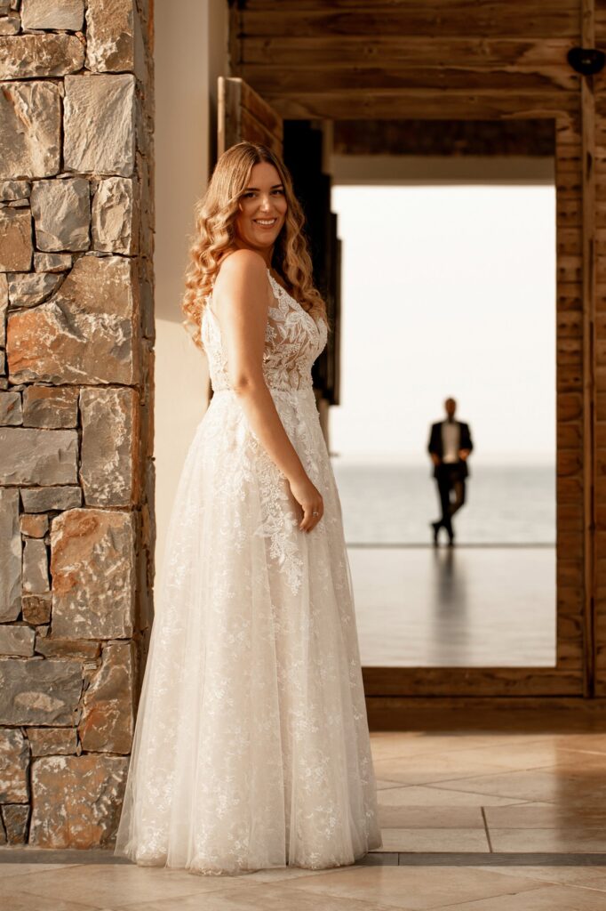 A shot of Marie standing in front of a door, with Theodore in the backround | Esthesis Events