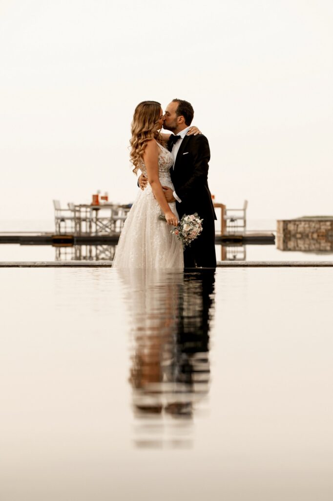 Marie and Theodore kissing at Kipos Aisthiseon | Esthesis Events