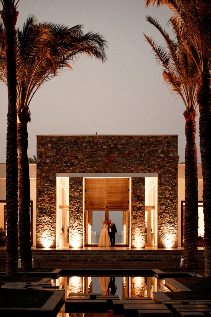 An evening shot of Marie and Theodore posing together at Kipos Aisthiseon | Esthesis Events
