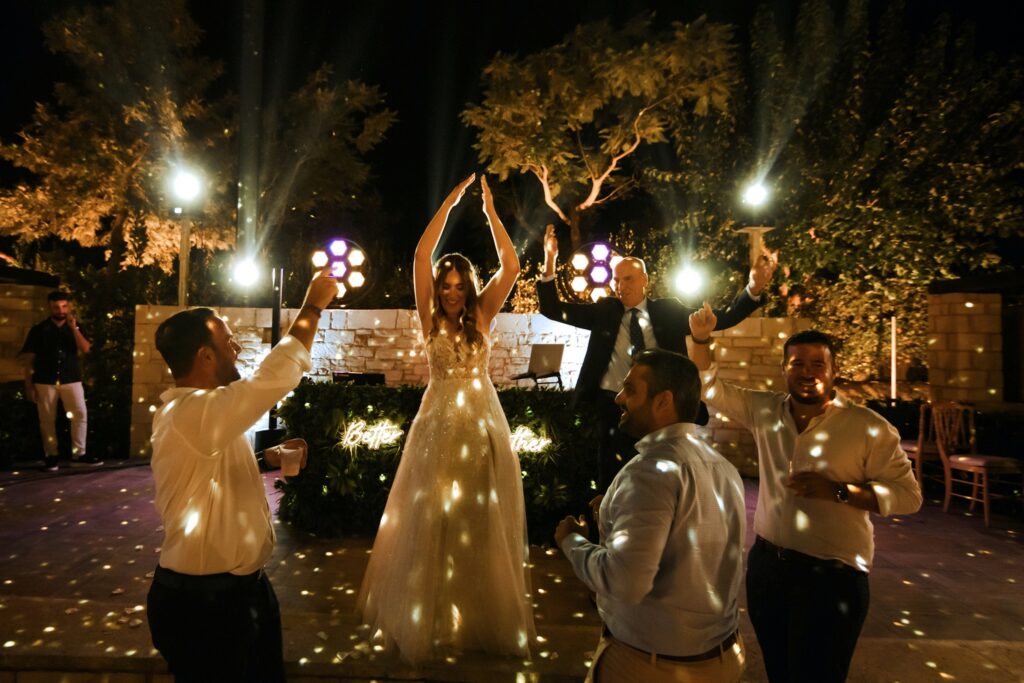 Marie dancing with friends and family at the wedding party | Esthesis Events