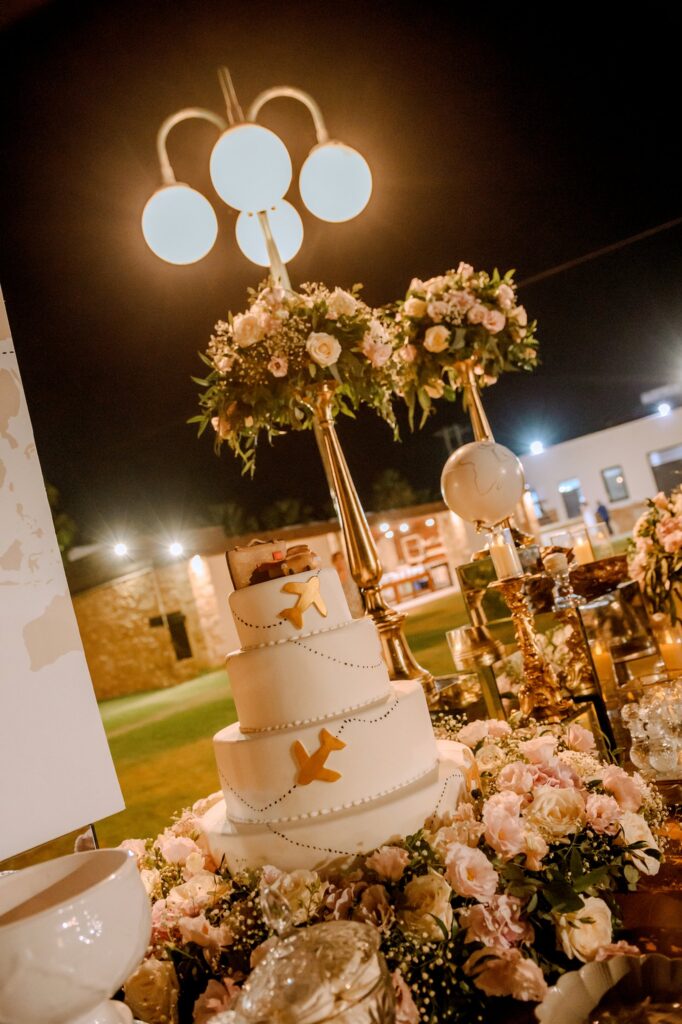 The wedding cake and the floral decorations at the wedding party | Esthesis Events