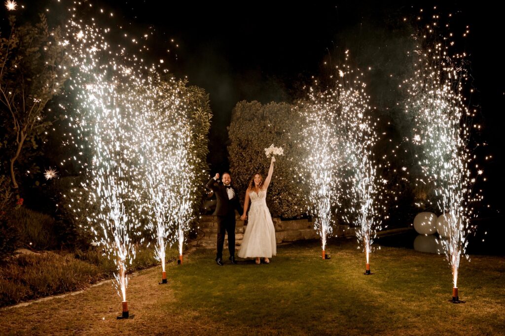 Marie and Theodore celebrating their wedding among sparklers | Esthesis Events