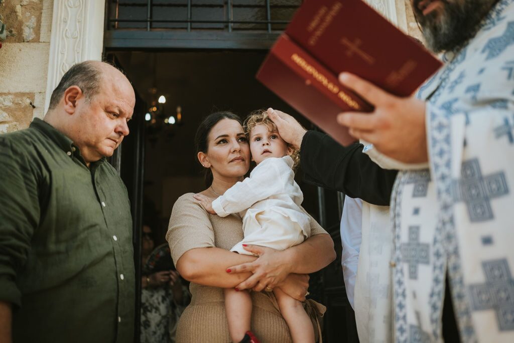 Yannis’ christening begins in the exterior courtyard of the monastery | Esthesis Events Yannis’ christening begins in the exterior courtyard of the monastery | Esthesis Events