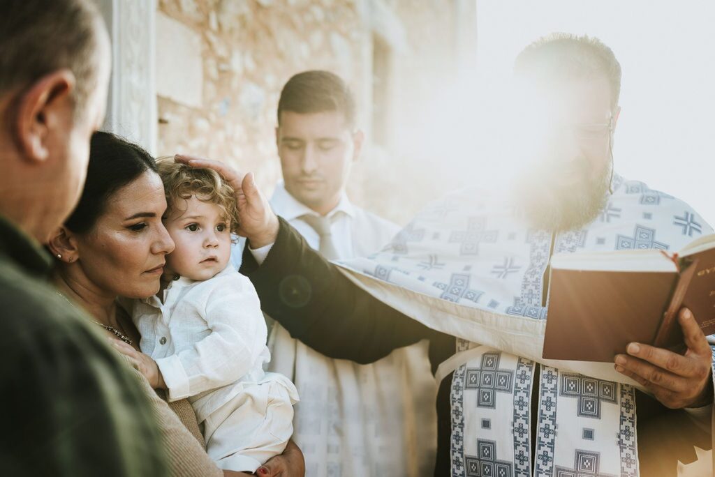 Yannis’ christening begins in the exterior courtyard of the monastery | Esthesis Events Yannis’ christening begins in the exterior courtyard of the monastery | Esthesis Events
