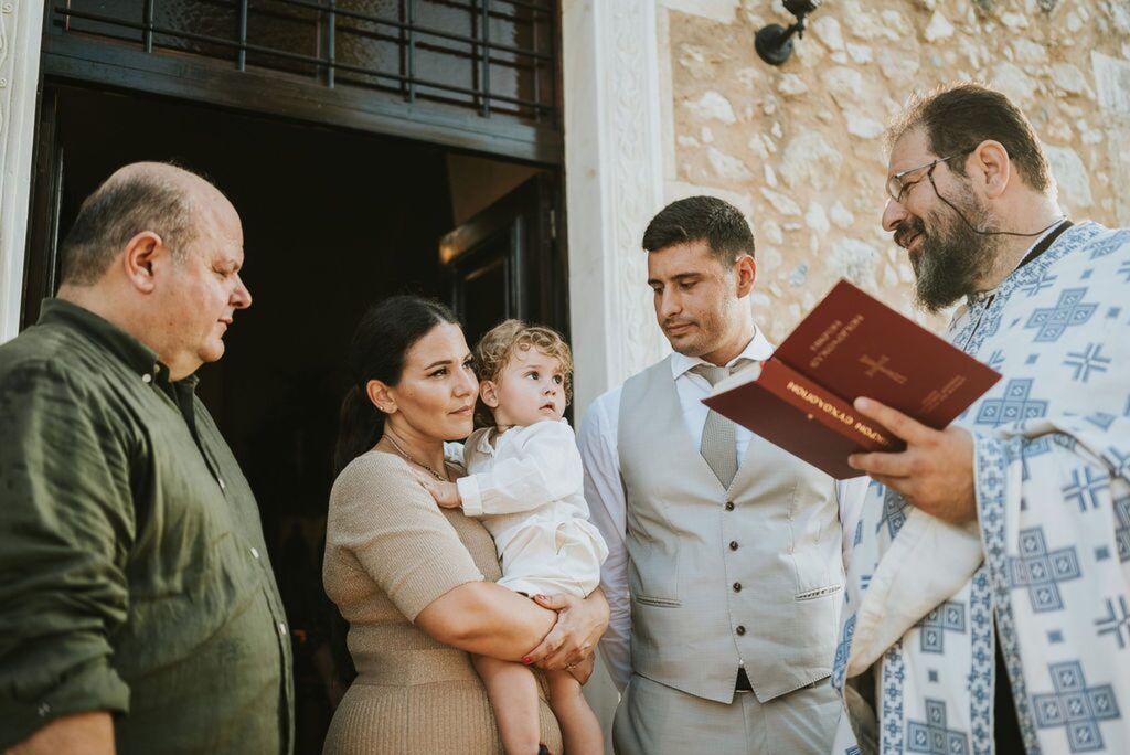 Yannis’ christening begins in the exterior courtyard of the monastery | Esthesis Events Yannis’ christening begins in the exterior courtyard of the monastery | Esthesis Events
