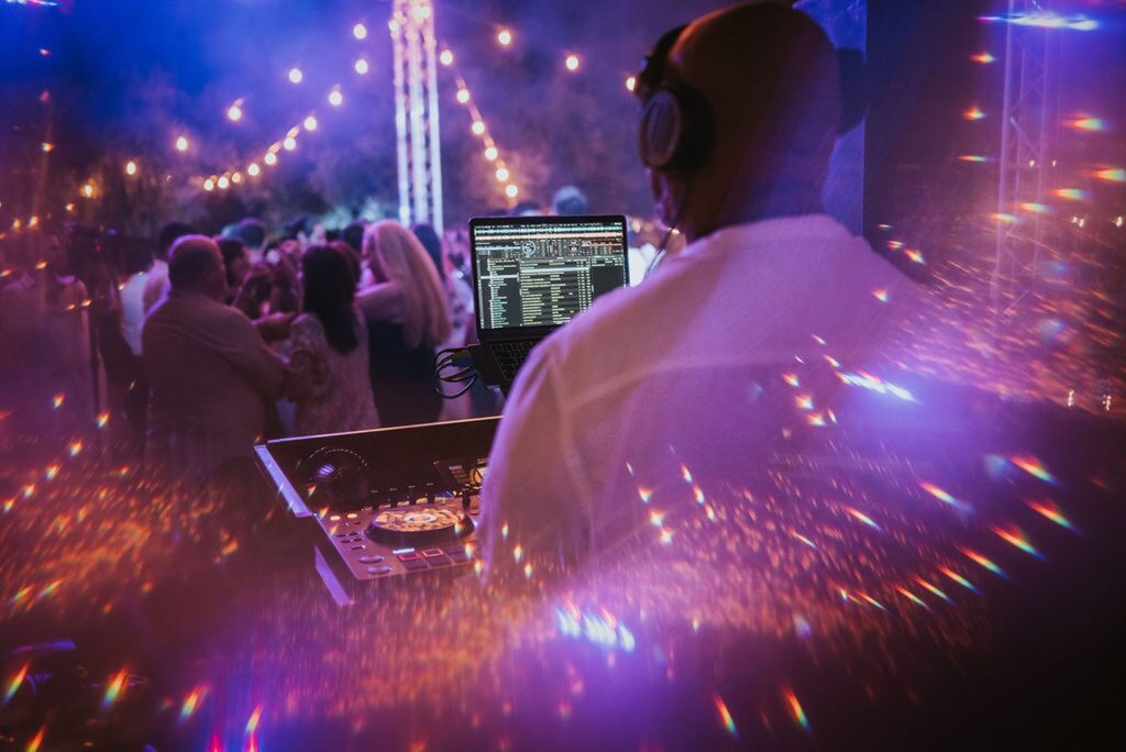 Dj playing during Yannis' christening reception | Esthesis Events Dj playing during Yannis' christening reception | Esthesis Events
