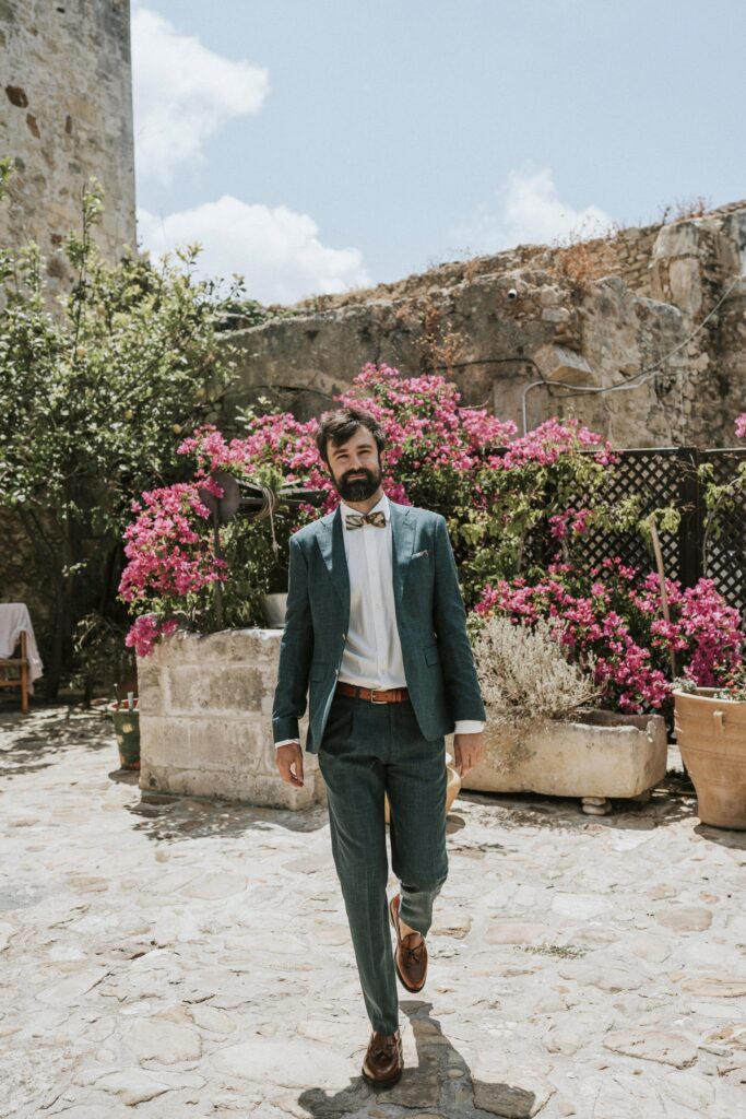 Michael smiling in his groom's attire at Agreco Farm. | Esthesis Events Michael smiling in his groom's attire at Agreco Farm. | Esthesis Events