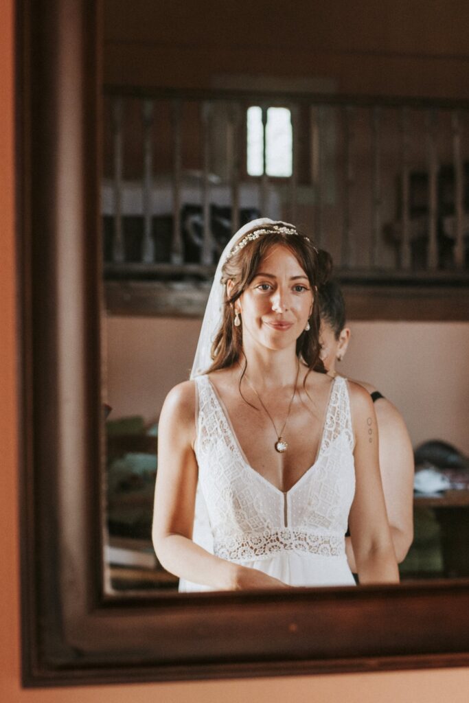 Jodie admiring herself in the mirror after putting on her wedding dress. | Esthesis Events Jodie admiring herself in the mirror after putting on her wedding dress. | Esthesis Events