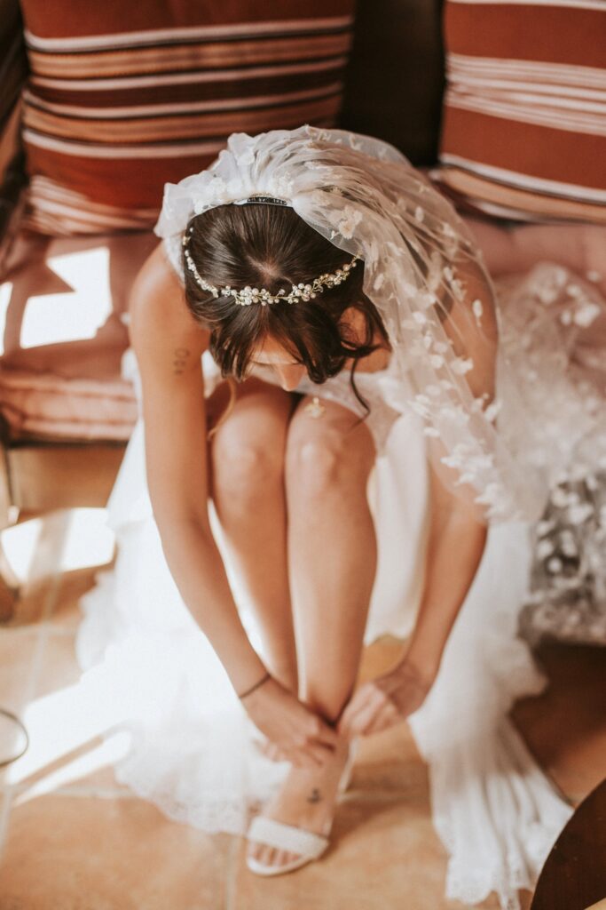 Jodie adjusting her wedding shoe. | Esthesis Events Jodie adjusting her wedding shoe. | Esthesis Events