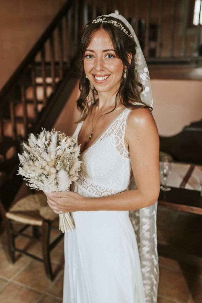 A portrait of Jodie in her wedding dress, holding her bridal bouquet. | Esthesis Events A portrait of Jodie in her wedding dress, holding her bridal bouquet. | Esthesis Events