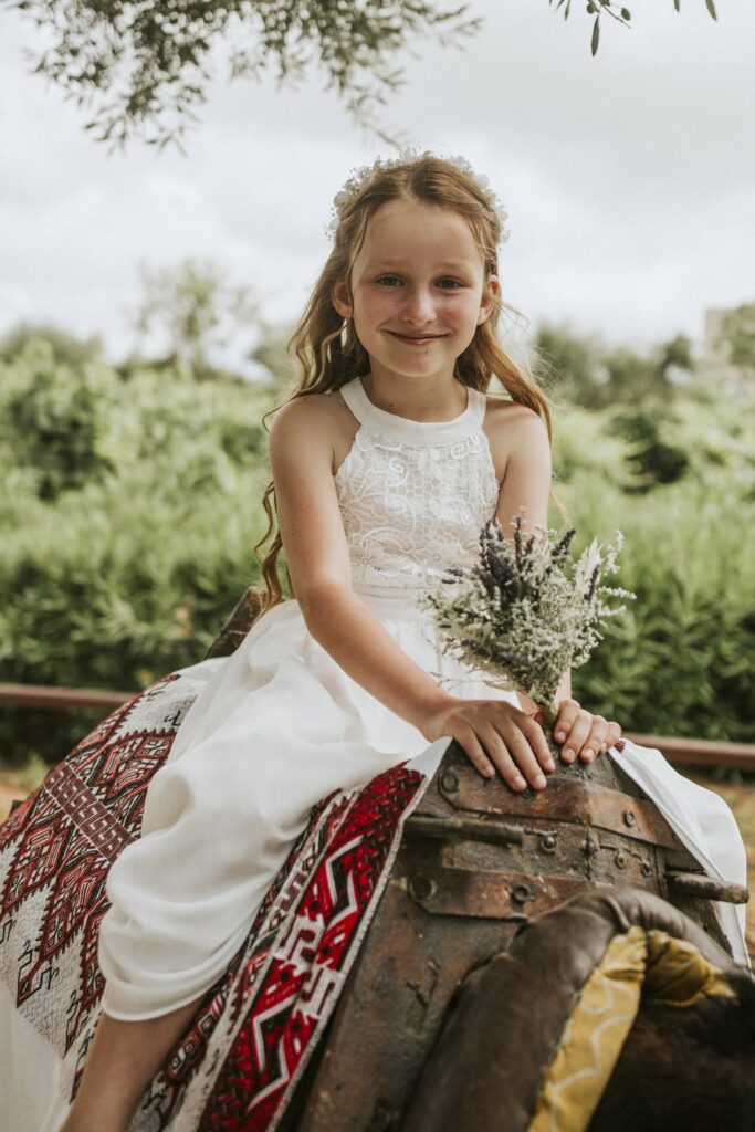A flower girl arriving on a donkey for the wedding ceremony. | Esthesis Events A flower girl arriving on a donkey for the wedding ceremony. | Esthesis Events