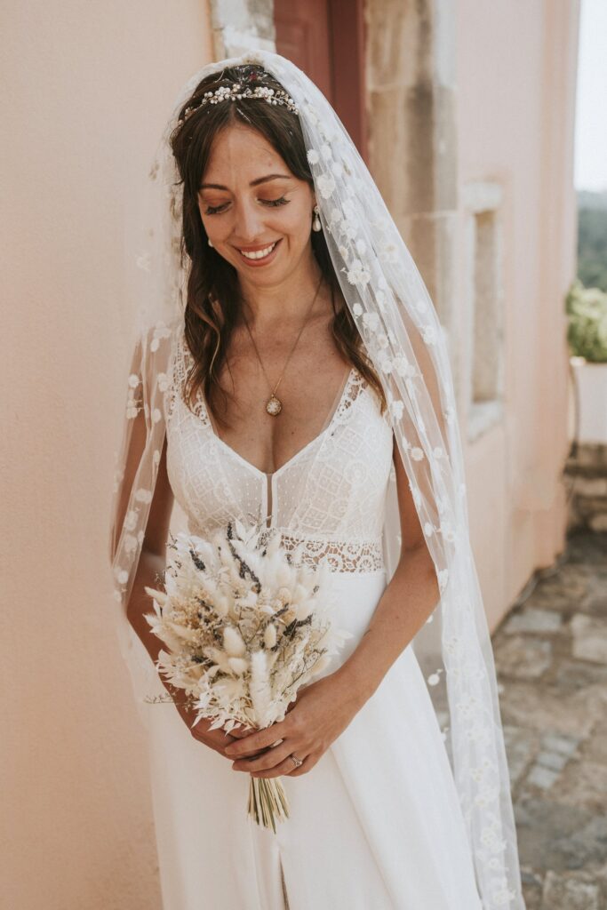 A beautiful portrait of the bride, Jodie, standing gracefully with her wedding bouquet. | Esthesis Events A beautiful portrait of the bride, Jodie, standing gracefully with her wedding bouquet. | Esthesis Events