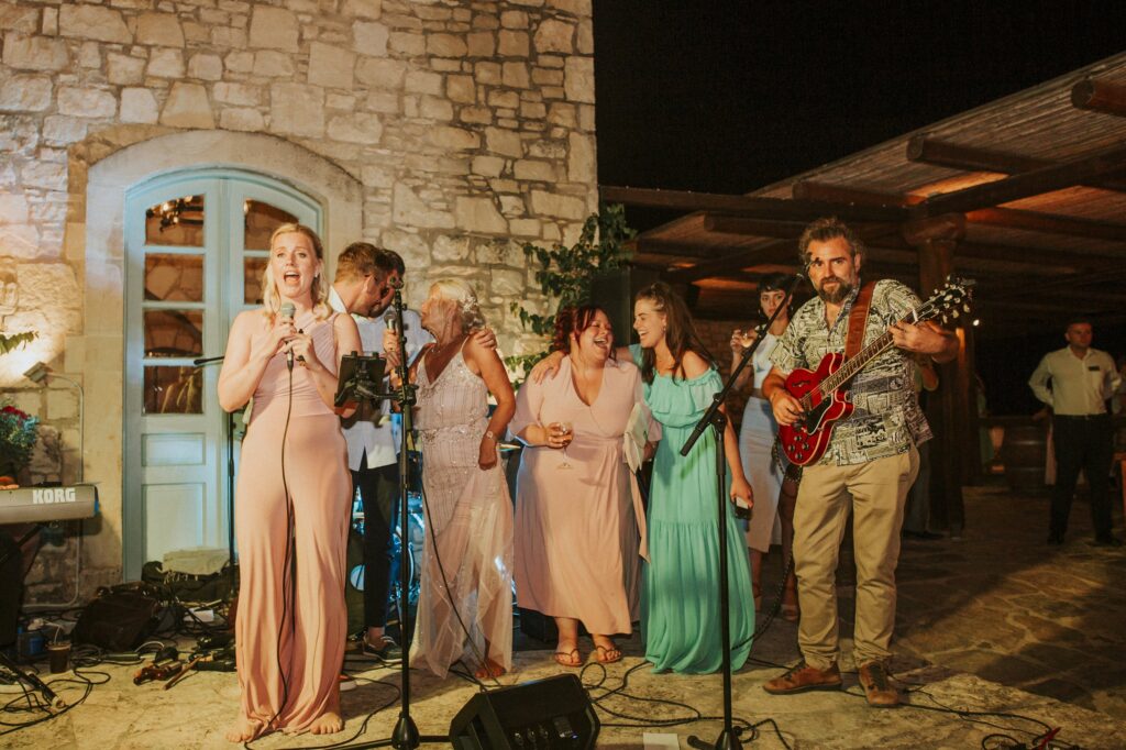 Wedding guests singing karaoke at the reception. | Esthesis Events Wedding guests singing karaoke at the reception. | Esthesis Events